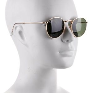 •   Ray-Ban Round Sunglasses
•   Gold Tone Metal
•   Tinted Lenses